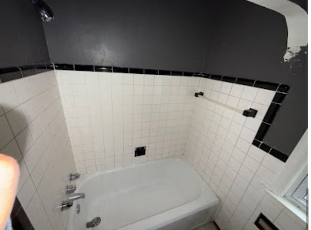 full bathroom with tile walls