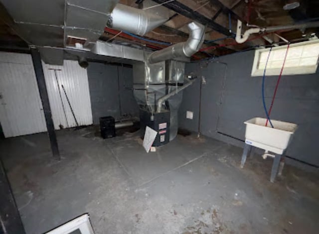 basement featuring heating unit