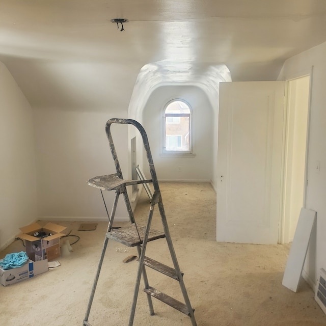 interior space featuring lofted ceiling