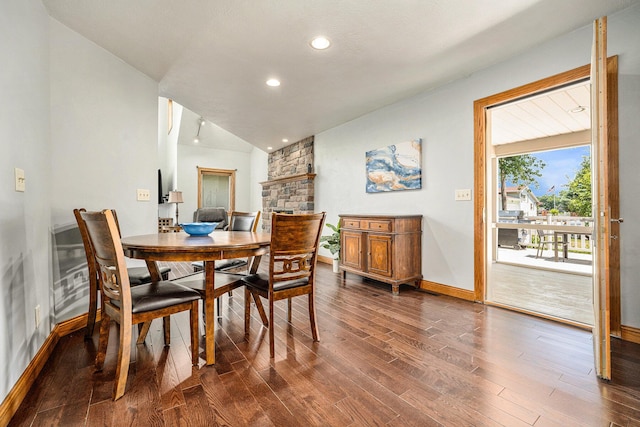 dining space with lofted ceiling, baseboards, dark wood-type flooring, and recessed lighting
