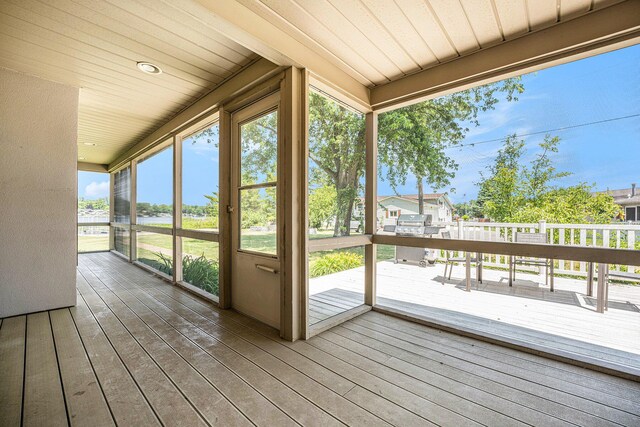 unfurnished sunroom featuring wooden ceiling