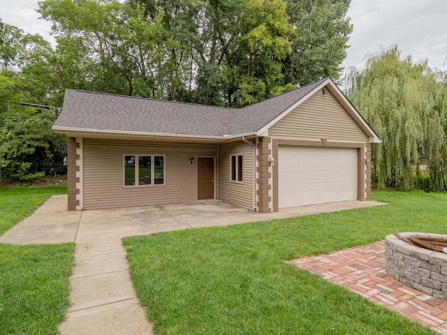 view of front of property with a patio area, a front lawn, an outdoor fire pit, and a shingled roof