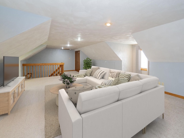 living room with light carpet, lofted ceiling, and baseboards