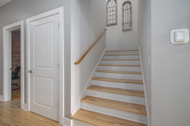 stairs with wood finished floors