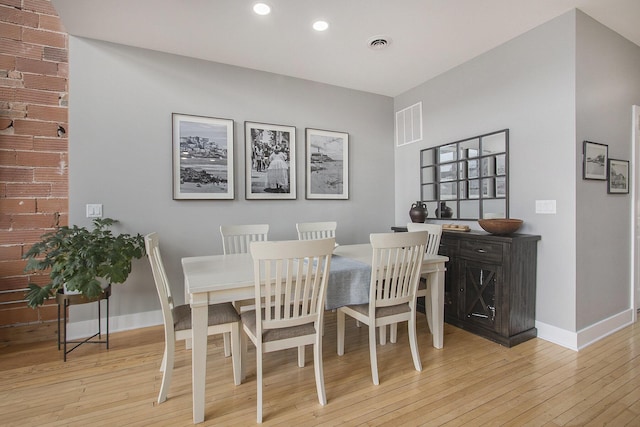 dining space featuring light wood-style floors, recessed lighting, visible vents, and baseboards