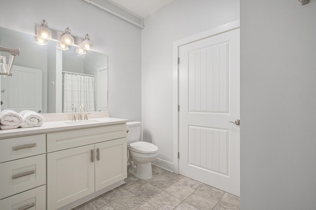 bathroom featuring vanity, toilet, and a shower with curtain