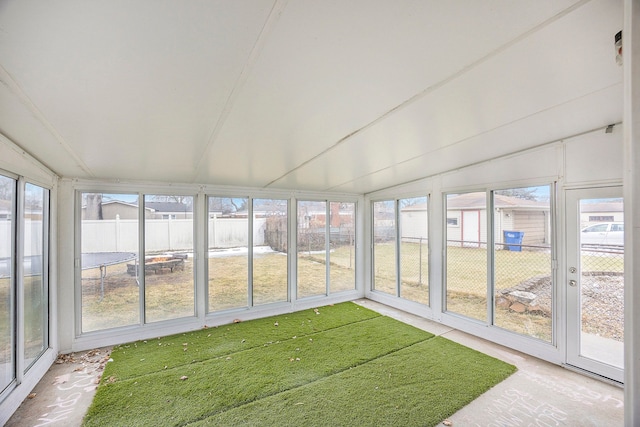 unfurnished sunroom with vaulted ceiling