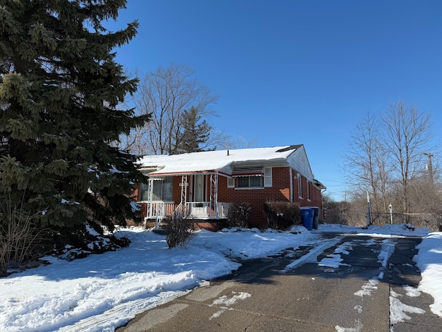 view of front of home featuring brick siding