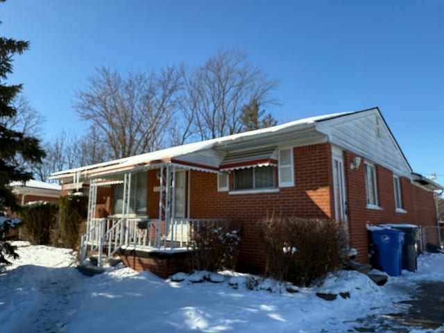 view of front of house with brick siding