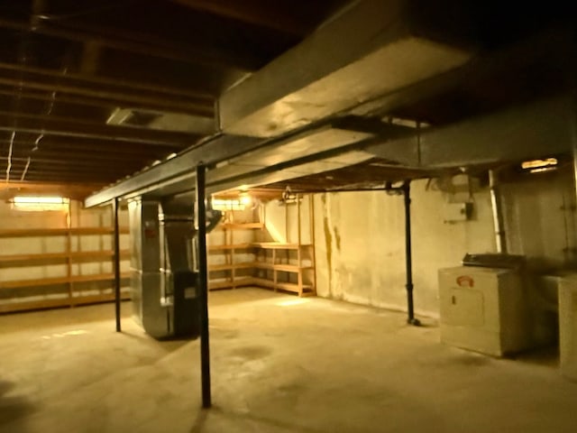 unfinished basement with heating unit