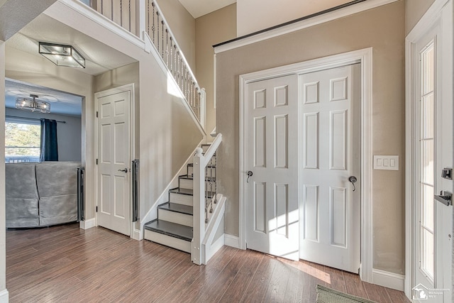 stairs featuring baseboards and wood finished floors