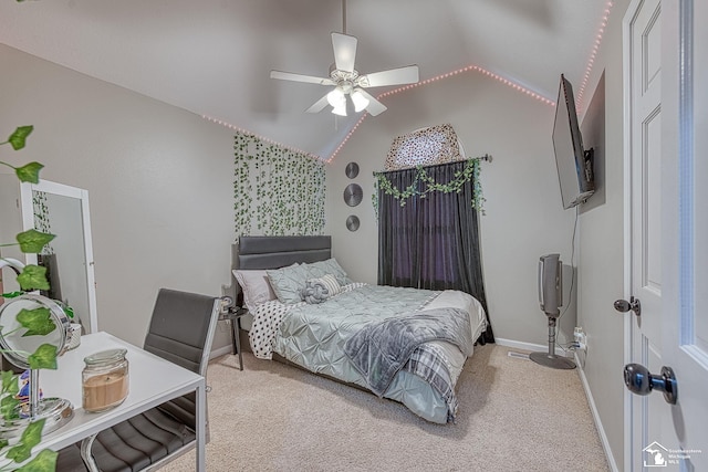 carpeted bedroom featuring lofted ceiling, a ceiling fan, and baseboards