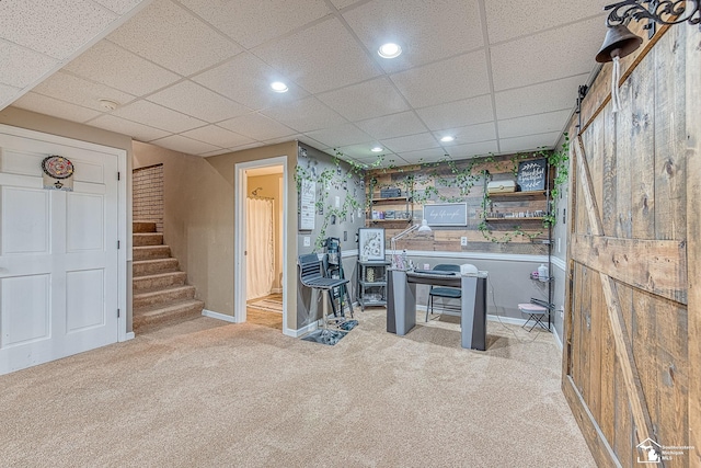 kitchen with recessed lighting, baseboards, a drop ceiling, and light colored carpet