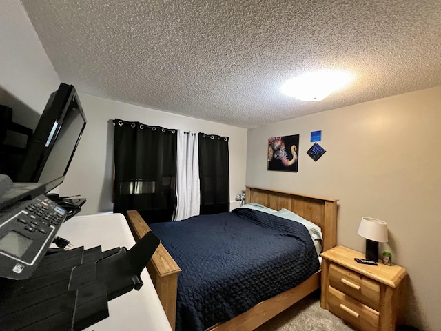 carpeted bedroom with a textured ceiling