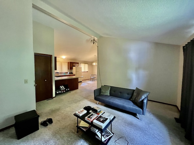 living area featuring lofted ceiling, light colored carpet, a notable chandelier, and a textured ceiling