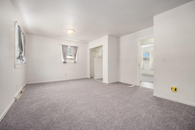 interior space featuring baseboards and carpet flooring