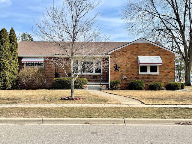 view of front of house featuring brick siding