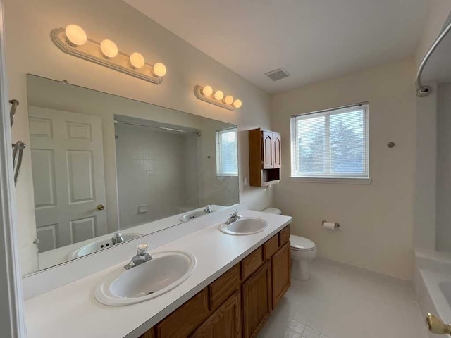 full bathroom featuring visible vents, a sink, and double vanity