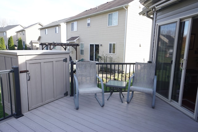 wooden deck featuring a residential view