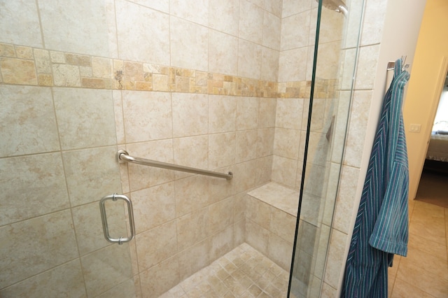 bathroom featuring ensuite bathroom and a stall shower