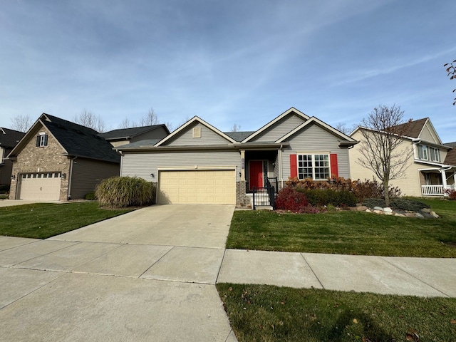 ranch-style home featuring an attached garage, driveway, and a front lawn