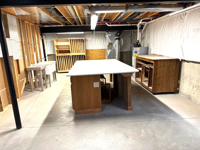 unfinished basement with a sink and gas water heater