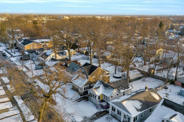 snowy aerial view featuring a residential view