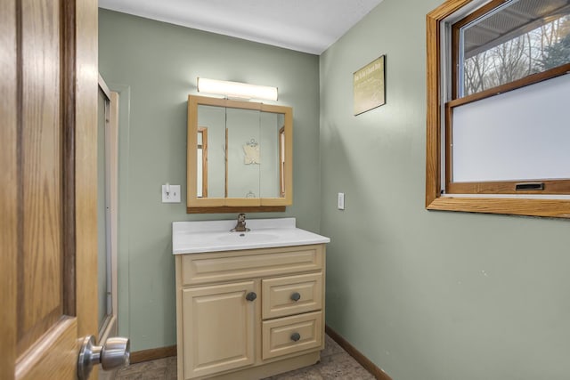 bathroom featuring vanity and baseboards