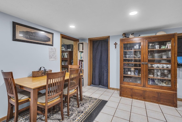 dining area with light tile patterned floors, baseboards, and recessed lighting