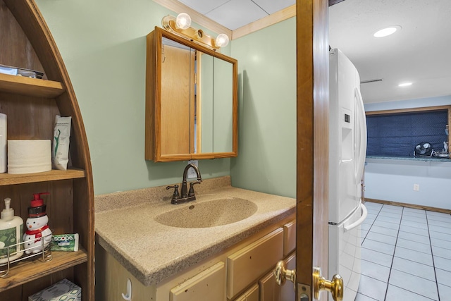 bathroom with recessed lighting, tile patterned flooring, and vanity