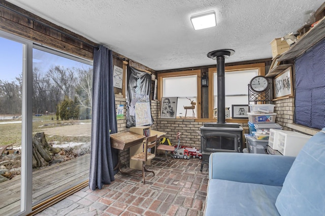 sunroom featuring a wood stove