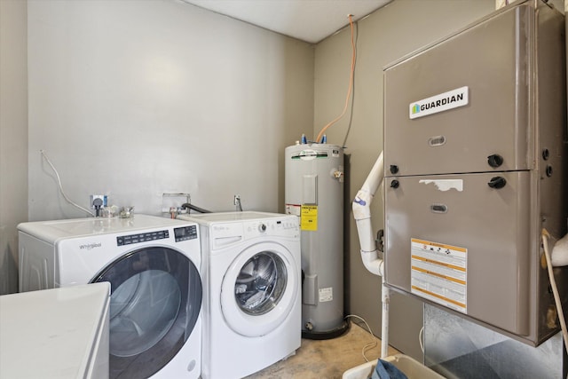 4087 Amble Rd, Coral, MI 49322 - clothes washing area with laundry area, electric water heater, washer and clothes dryer, and heating unit
