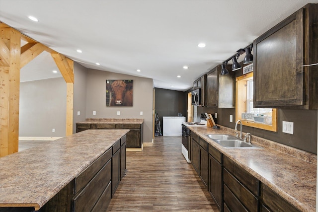 4087 Amble Rd, Coral, MI 49322 - kitchen featuring white range with electric cooktop, stainless steel microwave, a center island, vaulted ceiling, and a sink