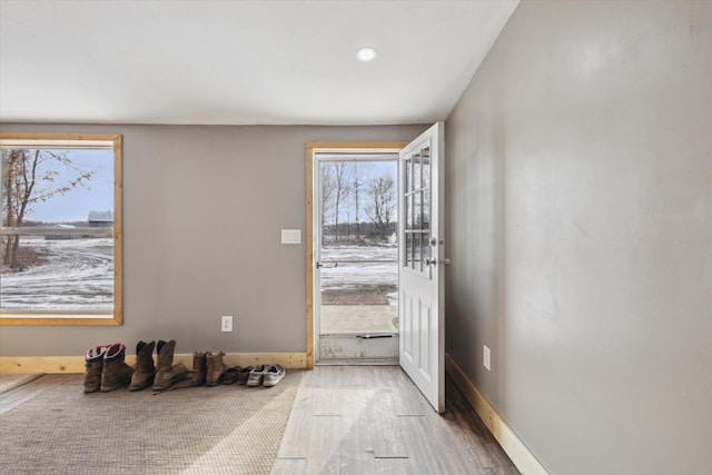 4087 Amble Rd, Coral, MI 49322 - doorway featuring baseboards and wood finished floors