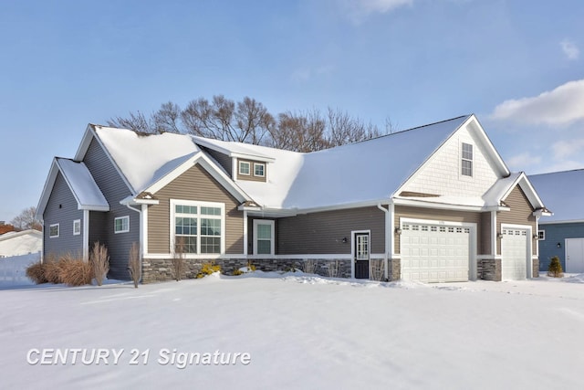 craftsman-style house with a garage and stone siding