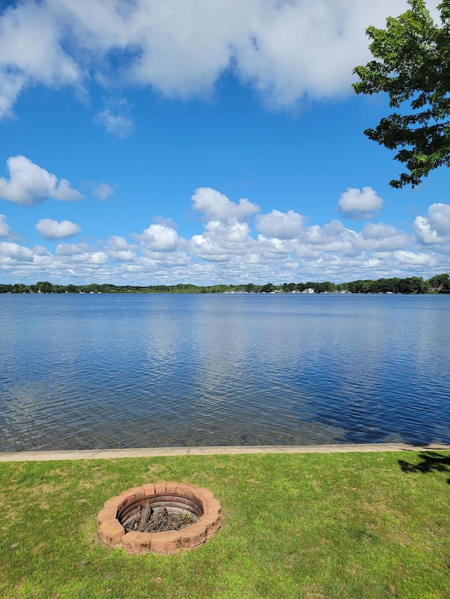 property view of water with a fire pit