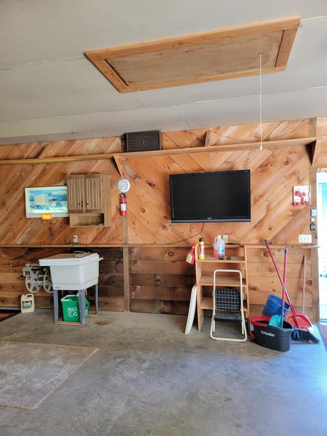 interior space featuring wood walls