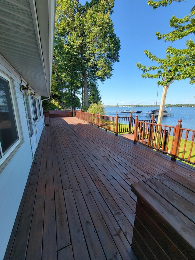 wooden deck with a water view