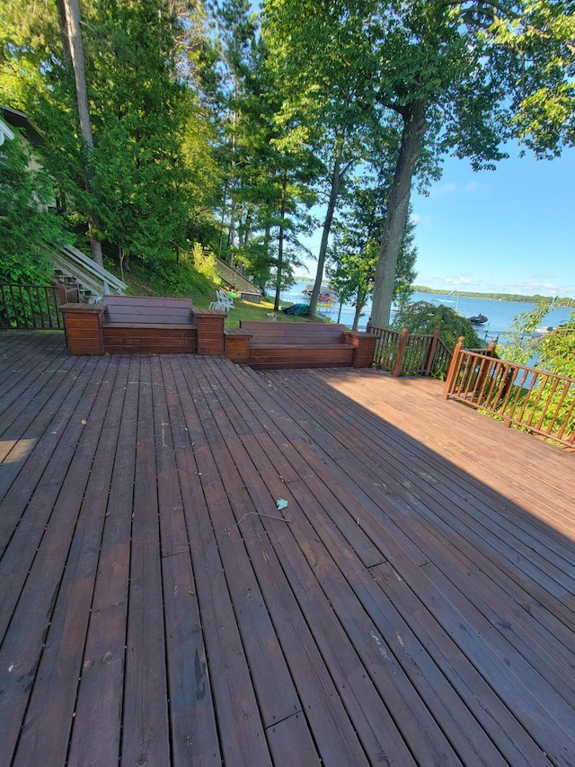 wooden deck with a water view