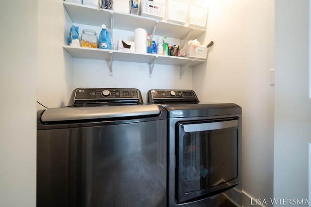 clothes washing area with laundry area and separate washer and dryer