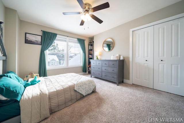 bedroom with a closet, a ceiling fan, and light colored carpet