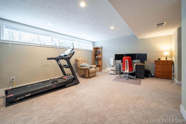 carpeted home office featuring baseboards, visible vents, a textured ceiling, and recessed lighting