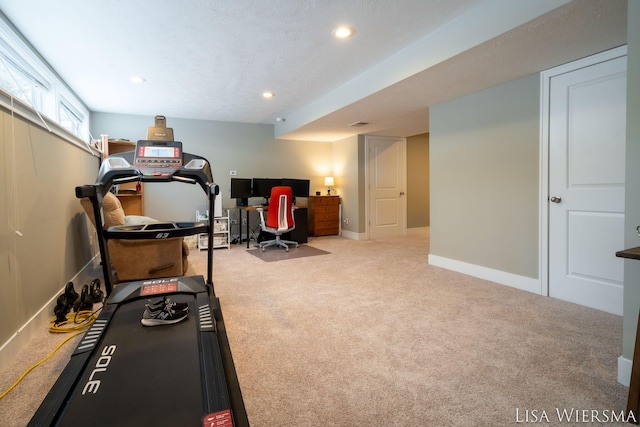 workout area with baseboards, a textured ceiling, recessed lighting, and light colored carpet