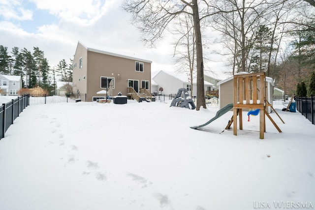 exterior space with fence and a playground