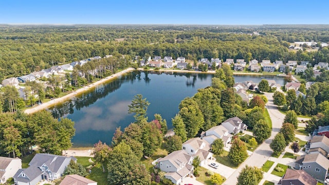 aerial view with a residential view, a water view, and a wooded view