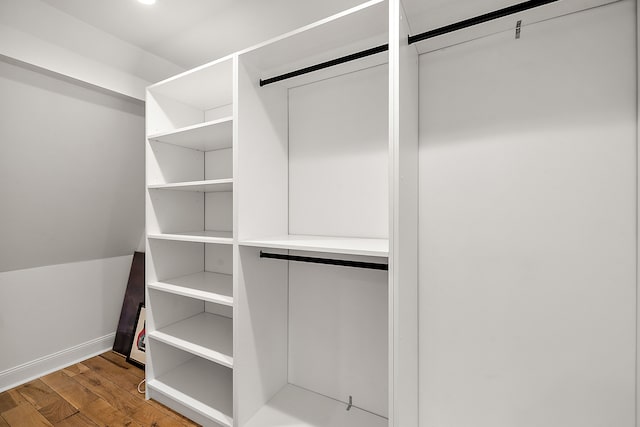 spacious closet featuring wood finished floors