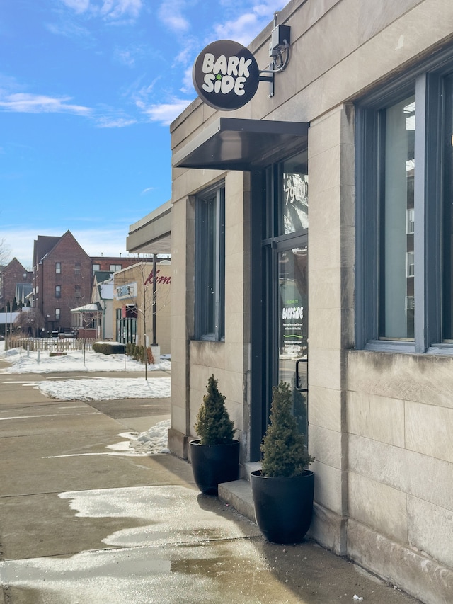 entrance to property with concrete block siding