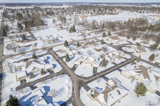 snowy aerial view featuring a residential view