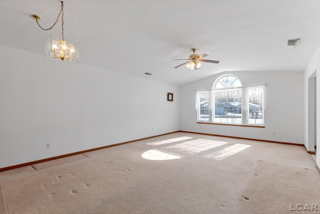 empty room featuring lofted ceiling, baseboards, visible vents, and light colored carpet