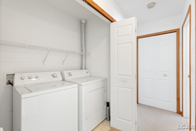 washroom with laundry area and washing machine and clothes dryer